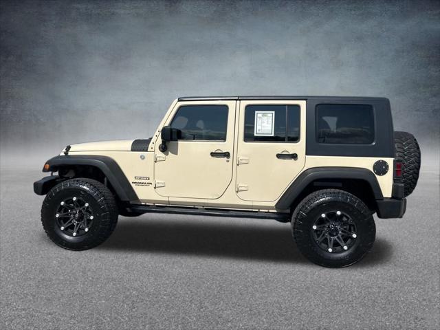 Photo of 2011 Sahara Tan Clearcoat Jeep Wrangler Unlimited