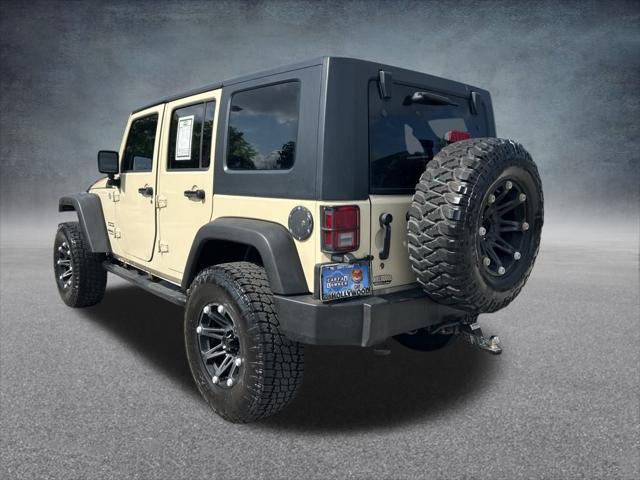 Photo of 2011 Sahara Tan Clearcoat Jeep Wrangler Unlimited