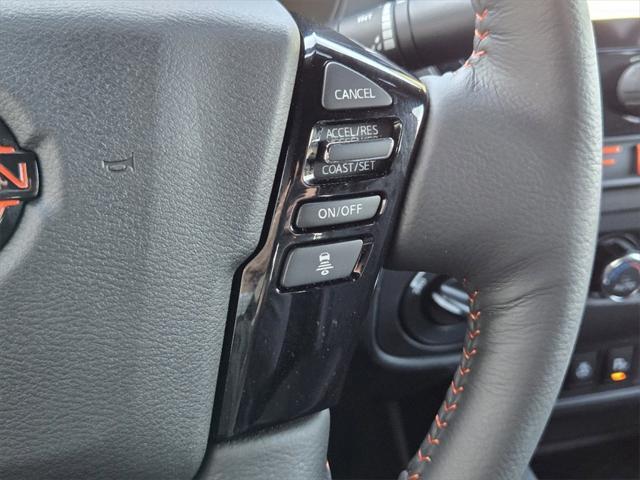 Photo of 2025 Afterburn Orange Nissan Frontier