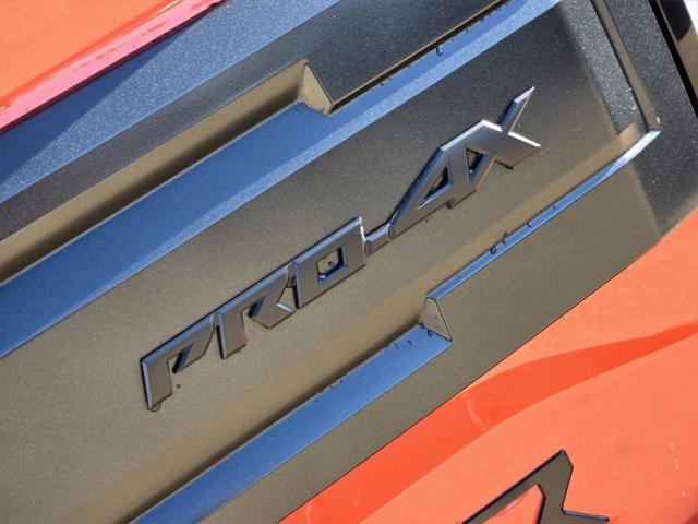 Photo of 2025 Afterburn Orange Nissan Frontier