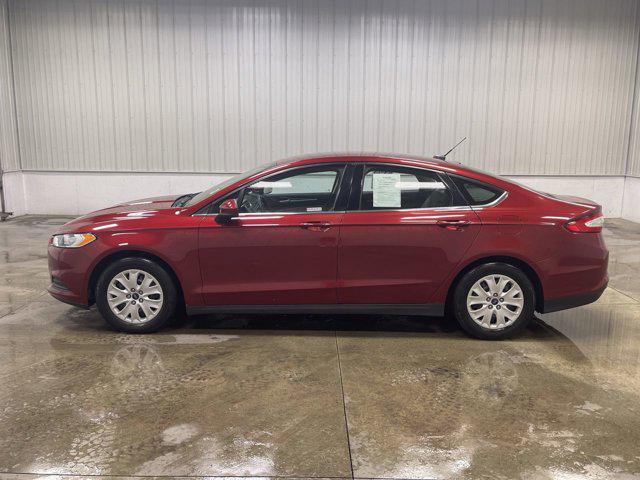 Photo of 2014 RUBY RED TINTED CLEARCOAT Ford Fusion