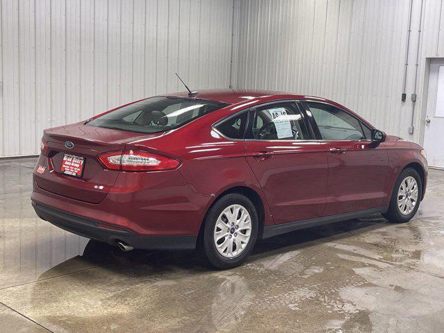 Photo of 2014 RUBY RED TINTED CLEARCOAT Ford Fusion