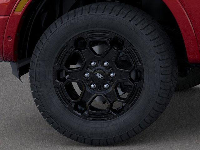 Photo of 2025 Ruby Red Metallic Tinted Clearcoat Ford Ranger
