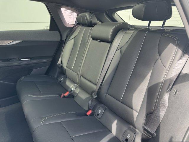 Photo of 2025 Crystal White Tri-Coat Cadillac OPTIQ