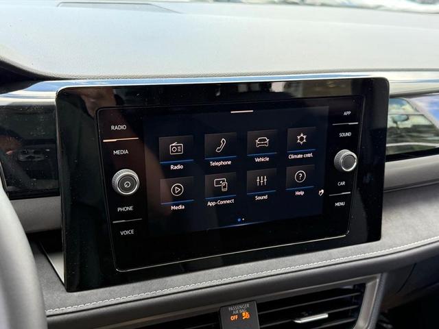 Photo of 2025 Pure White W/Black Roof Volkswagen Taos