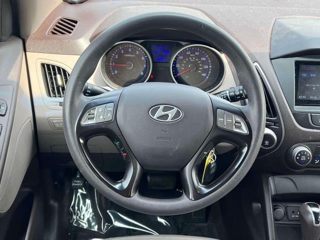 Photo of 2015 Garnet Red Mica Hyundai TUCSON