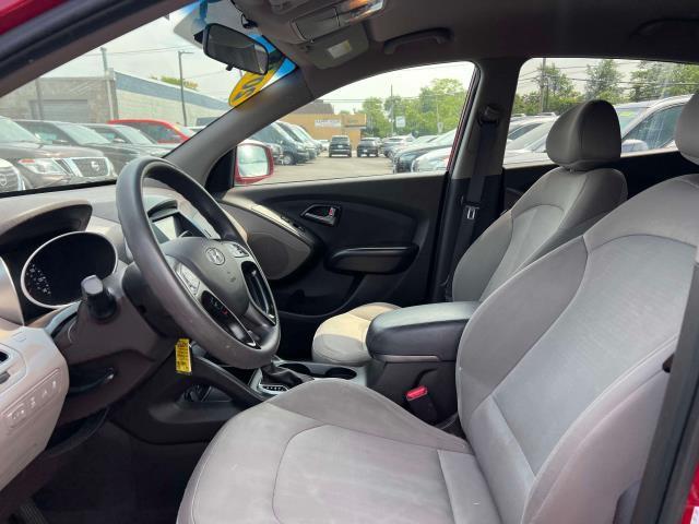 Photo of 2015 Garnet Red Mica Hyundai TUCSON