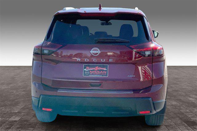 Photo of 2025 Scarlet Ember Tintcoat Nissan Rogue