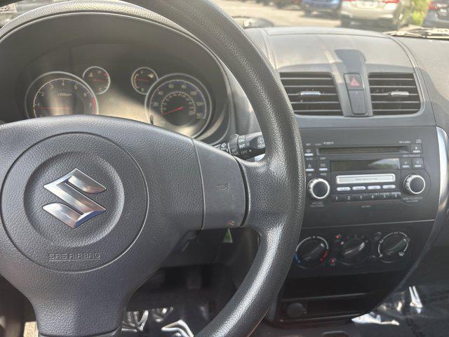 Photo of 2010 Vivid Red Suzuki SX4