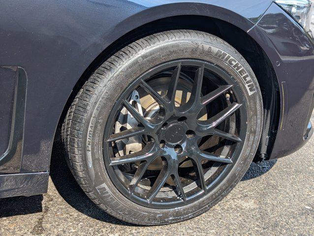 Photo of 2022 Carbon Black Metallic BMW 740