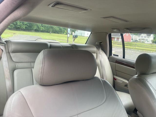 Photo of 1998 White Diamond Cadillac DeVille