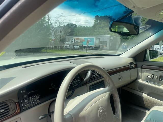 Photo of 1998 White Diamond Cadillac DeVille