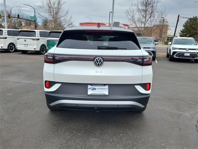 Photo of 2025 Opal White Pearl W / Black Roof Volkswagen ID.4