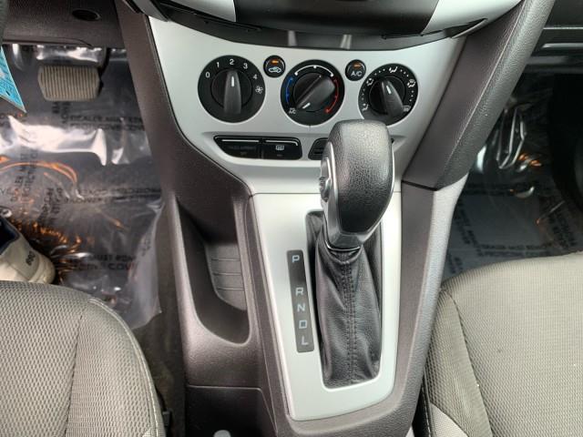 Photo of 2014 Ruby Red Tinted Clearcoat Ford Focus