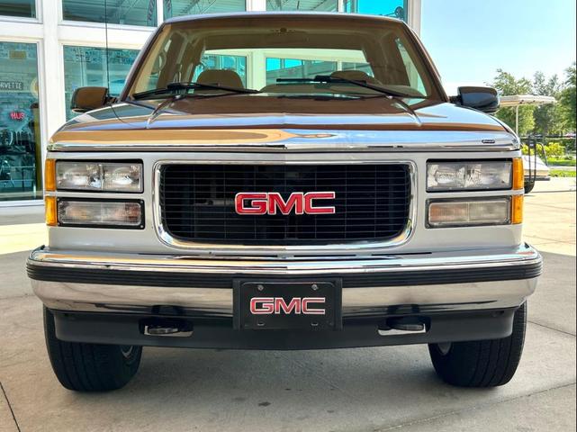 Photo of 1995 Burgandy and Silver GMC Sierra 1500