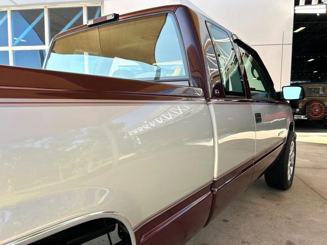 Photo of 1995 Burgandy and Silver GMC Sierra 1500