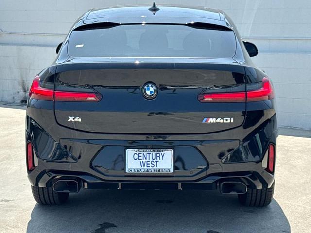 Photo of 2024 Black Sapphire Metallic BMW X4
