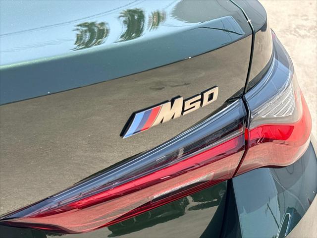 Photo of 2022 San Remo Green Metallic BMW i4 Gran Coupe