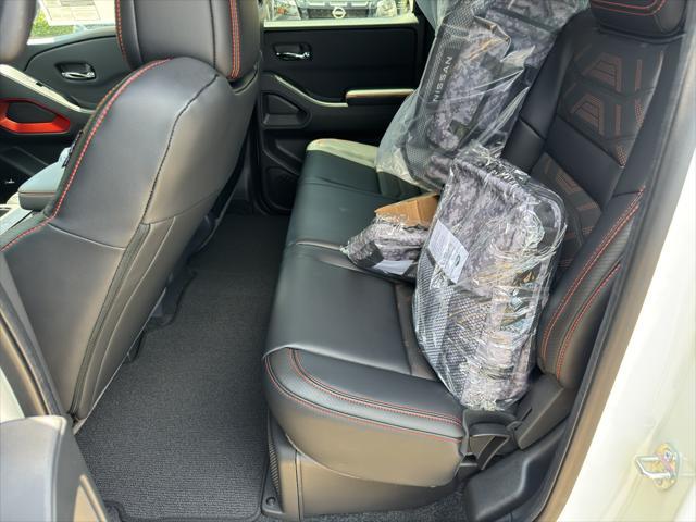 Photo of 2025 Glacier White Nissan Frontier