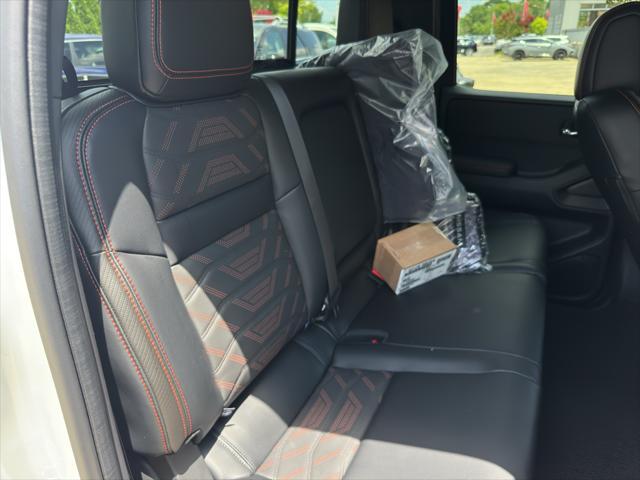 Photo of 2025 Glacier White Nissan Frontier