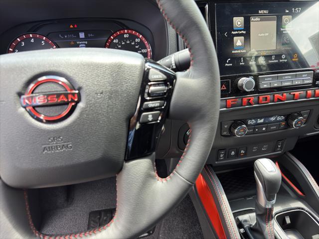 Photo of 2025 Glacier White Nissan Frontier