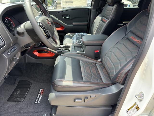 Photo of 2025 Glacier White Nissan Frontier