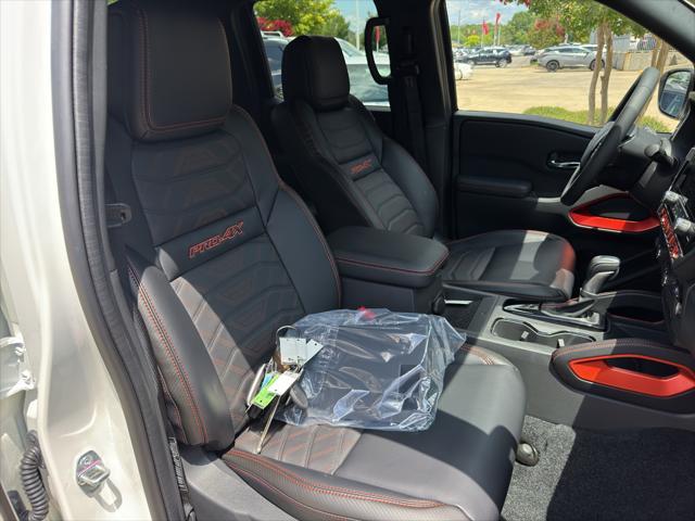 Photo of 2025 Glacier White Nissan Frontier