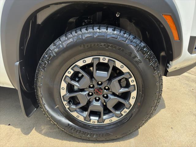 Photo of 2025 Glacier White Nissan Frontier