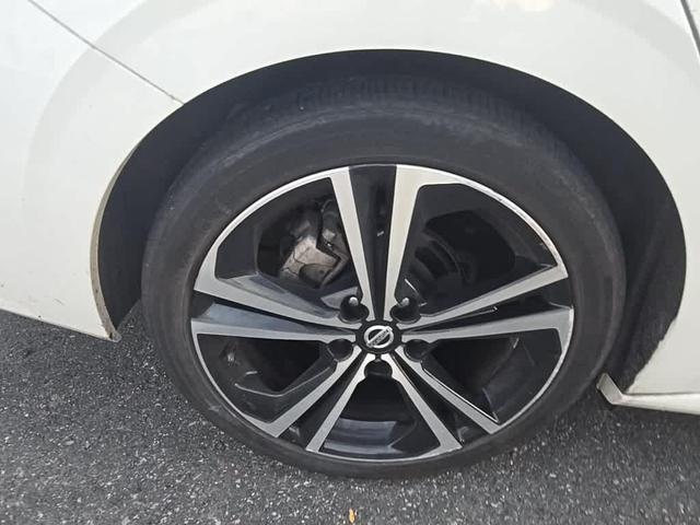 Photo of 2023 Aspen White Tricoat Nissan Sentra