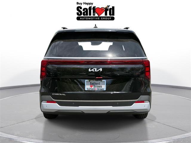 Photo of 2025 Aurora Blue Kia Carnival