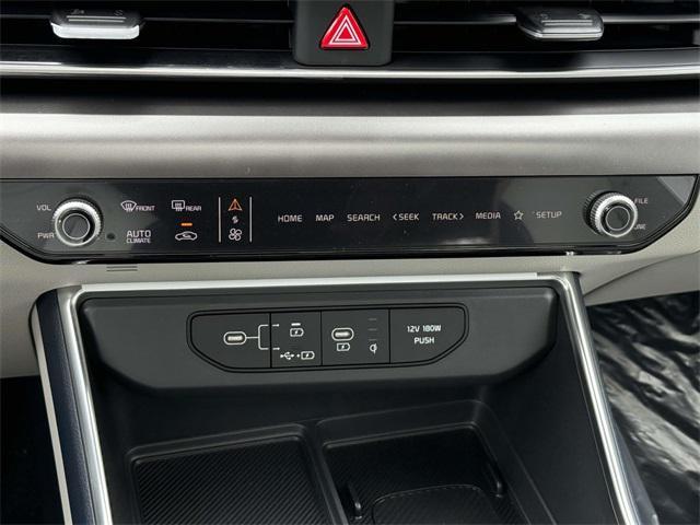 Photo of 2026 Ceramic White Kia Carnival Hybrid