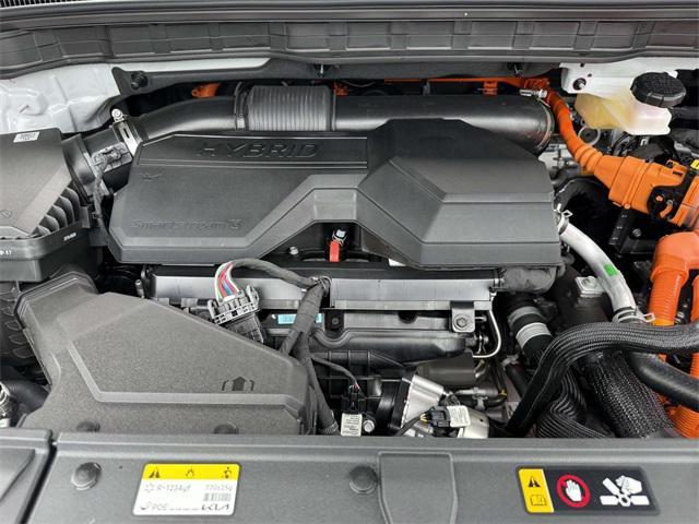 Photo of 2026 Ceramic White Kia Carnival Hybrid