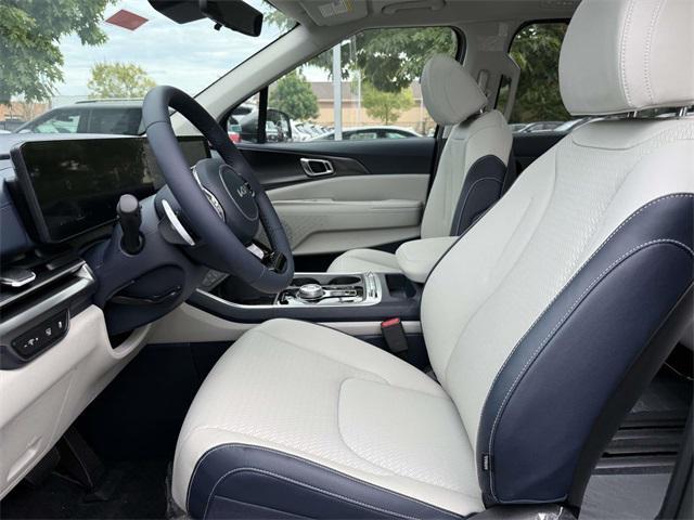 Photo of 2026 Ceramic White Kia Carnival Hybrid