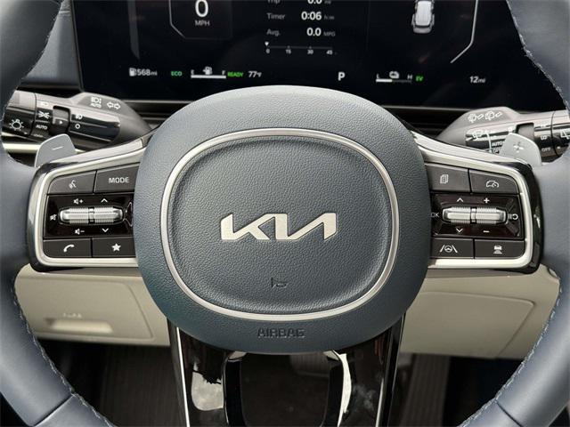 Photo of 2026 Ceramic White Kia Carnival Hybrid