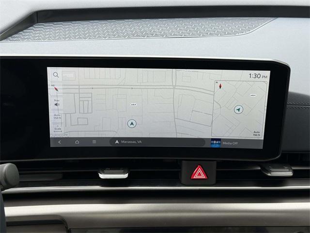 Photo of 2026 Ceramic White Kia Carnival Hybrid