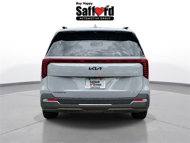 Photo of 2026 Ceramic White Kia Carnival Hybrid