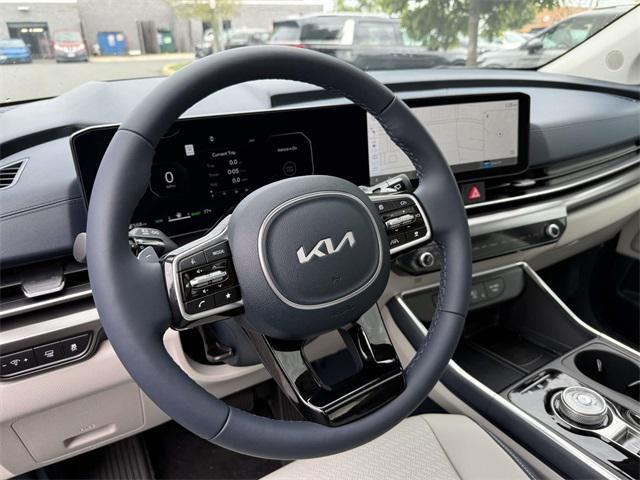 Photo of 2026 Ceramic White Kia Carnival Hybrid