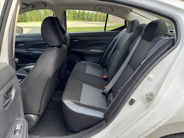 Photo of 2025 Aspen White Tricoat Nissan Versa