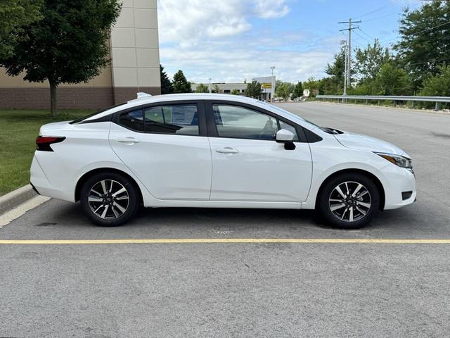 Photo of 2025 Aspen White Tricoat Nissan Versa