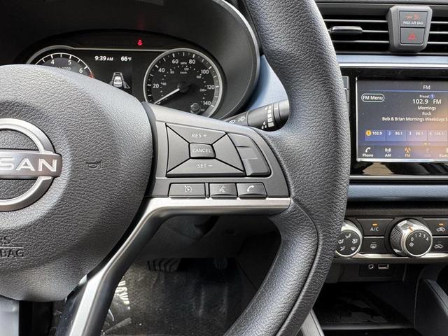 Photo of 2025 Aspen White Tricoat Nissan Versa