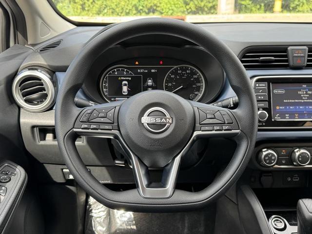 Photo of 2025 Aspen White Tricoat Nissan Versa