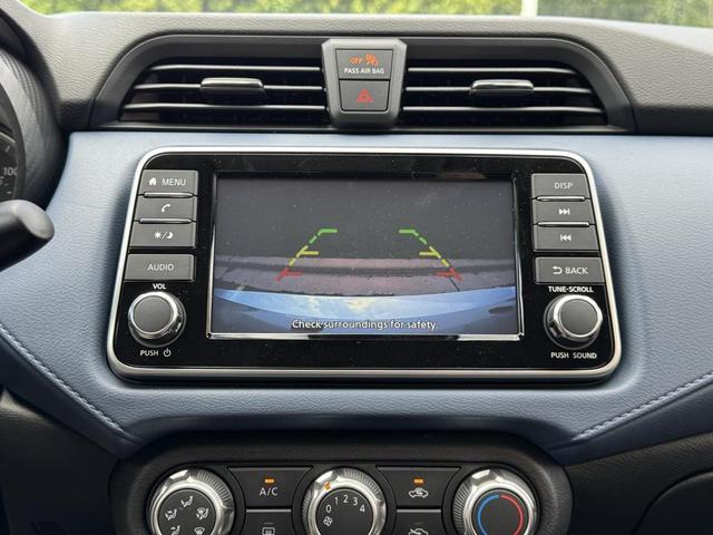 Photo of 2025 Aspen White Tricoat Nissan Versa