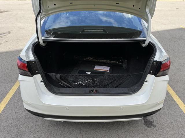 Photo of 2025 Aspen White Tricoat Nissan Versa