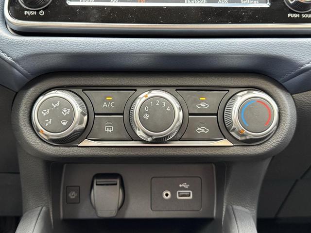 Photo of 2025 Aspen White Tricoat Nissan Versa