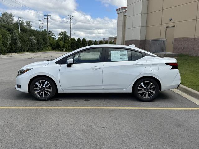 Photo of 2025 Aspen White Tricoat Nissan Versa