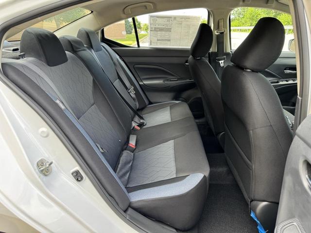 Photo of 2025 Aspen White Tricoat Nissan Versa