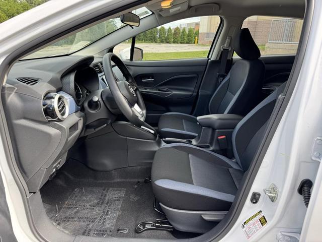 Photo of 2025 Aspen White Tricoat Nissan Versa