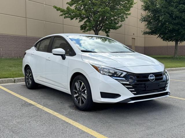 Photo of 2025 Aspen White Tricoat Nissan Versa