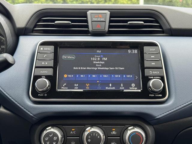 Photo of 2025 Aspen White Tricoat Nissan Versa