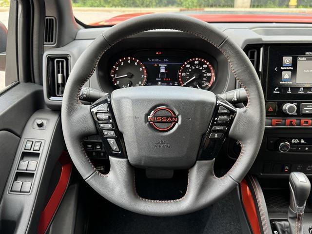 Photo of 2025 Afterburn Orange Nissan Frontier